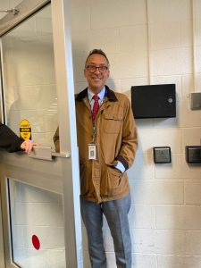 Mr. Schaperjahn joyfully (and swiftly) opens doors for students! 